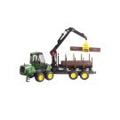 John Deere 1210E loader with grab and 4 tree trunks